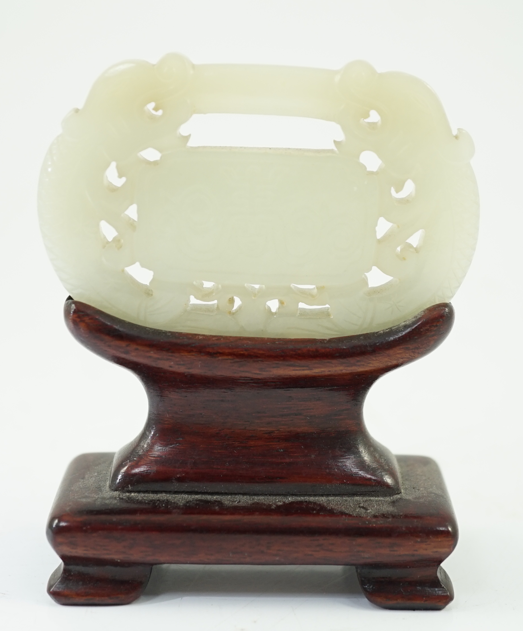 A Chinese pale celadon jade ‘lock’ pendant, 19th century